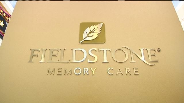 Fieldstone Memory Care Hold Ribbon Cutting for New